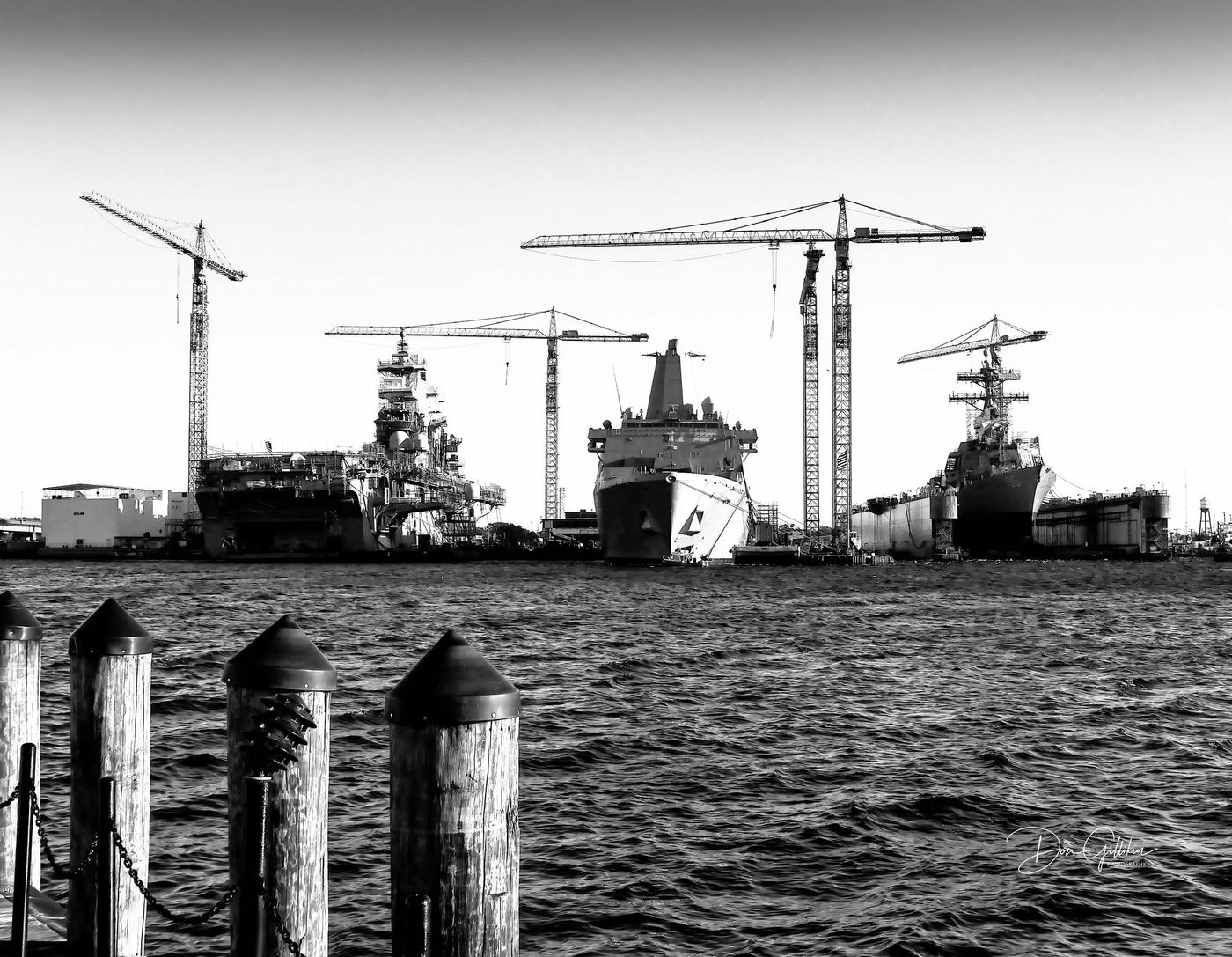 Shipyard cranes and hulls, Mobile, Alabama — photograph by Don Gillikin